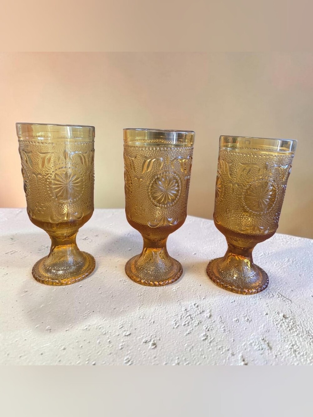 Set Of 3- 1970s Tiara Indiana Glass footed tumbler in the Amber Sandwich pattern